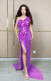Makayla sleeveless prom dress with rhinestone flower details.