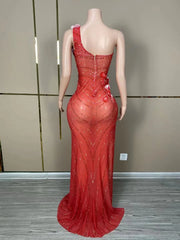 Makayla sleeveless prom dress with rhinestone flower details.