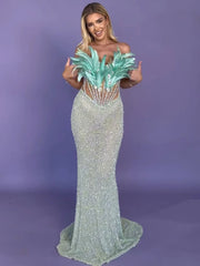 Zahara strapless blue mermaid prom dress with sweetheart neckline, sequins, feathers, and beaded diamonds.