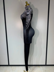 Audre luxury rhinestone stretch jumpsuit with shimmering rhinestones and fitted silhouette.