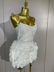 Kelsey white off-shoulder bandage mini dress with pearl chain accents and three-dimensional floral embellishments