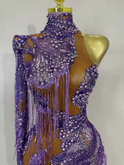 Leonna purple diamond tassel one shoulder mesh jumpsuit for women. Sparkly outfit for festivals, birthdays, nightlife, and stage wear.