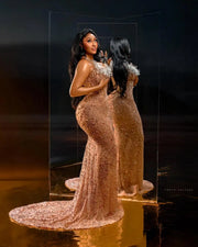 Golden beaded prom dress with luxury detailing and fitted silhouette.