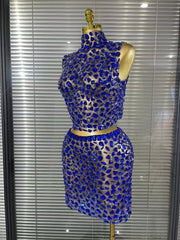 Amber crystal mesh two piece bodycon mini dress set for women. Sexy outfit for nightlife, stage wear, and party events.