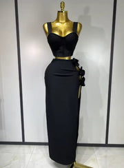 Black and red floral bandage two piece outfit with fitted top and skirt.