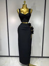 Black and red floral bandage two piece outfit with fitted top and skirt.