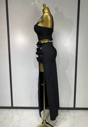 Black and red floral bandage two piece outfit with fitted top and skirt.