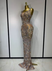 Eniola sheer mesh long dress encrusted with luxury diamonds for a high-fashion, see-through evening look.