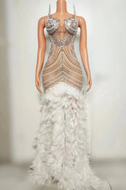 Tiana sparkly long prom dress with rhinestones, pearls, and feather details.