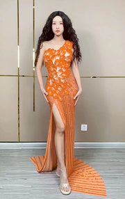 Makayla sleeveless prom dress with rhinestone flower details.
