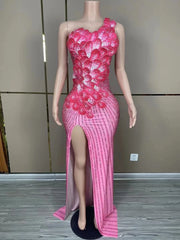Makayla sleeveless prom dress with rhinestone flower details.