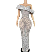 Elegant long-sleeve evening dress with a detailed pattern of sparkling pearls and rhinestone embellishments. Skai luxury formal gown.