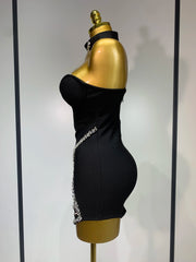 Jamilah strapless mini bodycon dress with rhinestone chain detailing and backless design for women’s birthday or evening parties.