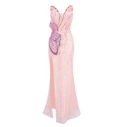Alessia pink strapless mermaid dress with pearl beading, floral appliqué, and high split, styled for formal events and glamorous occasions.