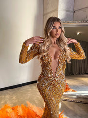 Beaded crystal feather mermaid evening dress with sparkling beadwork and elegant feather details.