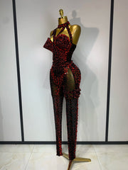 Turn heads in the Amanda backless red rhinestone black mesh jumpsuit. Sparkly bodycon outfit for stage performances, parties, and birthdays.