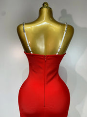 Red backless bodycon maxi dress with diamond embellishments.
