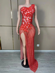 Makayla sleeveless prom dress with rhinestone flower details.