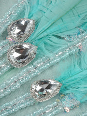 Zahara strapless blue mermaid prom dress with sweetheart neckline, sequins, feathers, and beaded diamonds.