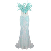 Zahara strapless blue mermaid prom dress with sweetheart neckline, sequins, feathers, and beaded diamonds.