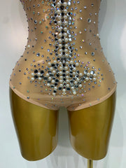 Candice rhinestone pearl mesh bodycon bodysuit for women. Luxury sparkly outfit for birthdays, stage wear, and nightlife events.
