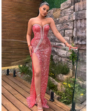 Lyra strapless backless maxi dress with diamond sequins, styled for formal events and high-glamour occasions.