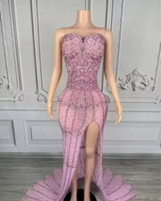 Nylah strapless rhinestone prom dress with high slit and see-through mesh design.