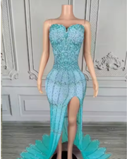 Nylah strapless rhinestone prom dress with high slit and see-through mesh design.