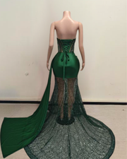 Simone sparkling emerald prom dress with green sequin details and elegant fitted design.