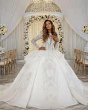 Princess wedding dress with luxury lace details and long sheer sleeves