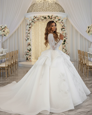 Princess wedding dress with luxury lace details and long sheer sleeves