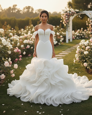 Modern mermaid wedding dress with fitted bodice and flared hem for elegant bridal look.