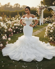 Modern mermaid wedding dress with fitted bodice and flared hem for elegant bridal look.