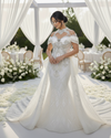 Classic short sleeve wedding dress with fitted bodice and sweep train for elegant bridal wear.