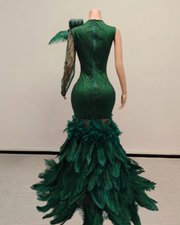 Green sparkly prom dress with rhinestones, diamond details, and ostrich feather train – elegant long evening gown for women