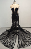Black beaded sweetheart mermaid prom gown with fitted silhouette and flared hem