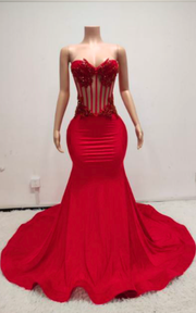 Eden Red mermaid evening gown with sheer beaded corset bodice and flowing train for evening events, birthdays, or stage appearances.