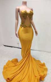 Eden Yellow mermaid evening gown with sheer beaded corset bodice and flowing train for evening events, birthdays, or stage appearances.