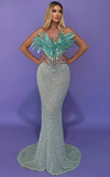 Zahara strapless blue mermaid prom dress with sweetheart neckline, sequins, feathers, and beaded diamonds.