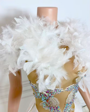 Sleeveless white birthday dress with feather accents and rhinestones, styled for glamorous parties and elegant evening events.