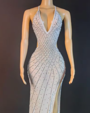 Nyomi sparkly rhinestone halter mesh transparent prom dress with shimmering details and elegant sheer fabric.
