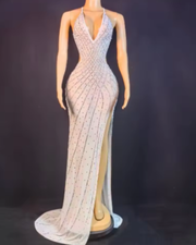 Nyomi sparkly rhinestone halter mesh transparent prom dress with shimmering details and elegant sheer fabric.