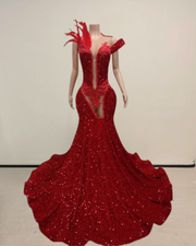 Pamela wearing a glitter red mermaid prom dress for prom night.