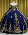 Navy blue off-shoulder quinceañera dress with gold appliqués, crystal embellishments, and full princess skirt.