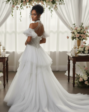 Luxury lace cap sleeve wedding gown with fitted bodice and flowing skirt for elegant bridal wear.