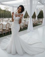 Summer mermaid wedding dress with high neck, fitted silhouette, and elegant detailing for brides.