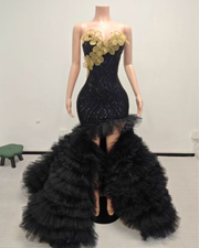 Sweetheart prom dress with floral appliqués and dramatic ruffled tulle skirt