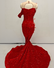 Red sequin mermaid gown with illusion bodice and 3D floral appliqué