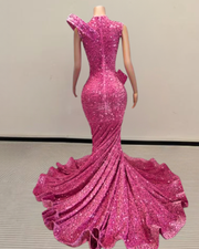Mermaid prom dress with flounce detailing and a long shimmering sequin train