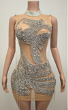 Sheer rhinestone mesh mini dress with sparkling details for parties and nightlife.